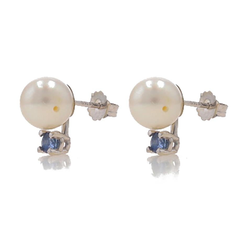 Metal Content: 14k White Gold

Stone Information

Cultured Pearls
Color: Cream
Size: 7.5mm & 7.6mm

Natural Sapphires
Treatment: Heating
Carat(s): .30ctw
Cut: Round
Color: Blue

Total Carats: .30ctw

Style: Stud
Fastening Type: Butterfly