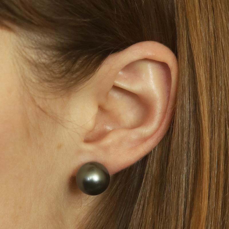 Metal Content: 14k White Gold

Stone Information

Cultured Tahitian Pearls
Color: Greenish Grey
Size: 12.5mm & 12.2mm

Style: Large Stud
Fastening Type: Butterfly Closures

Measurements

Item 1: Earring 1
Diameter: 1/2