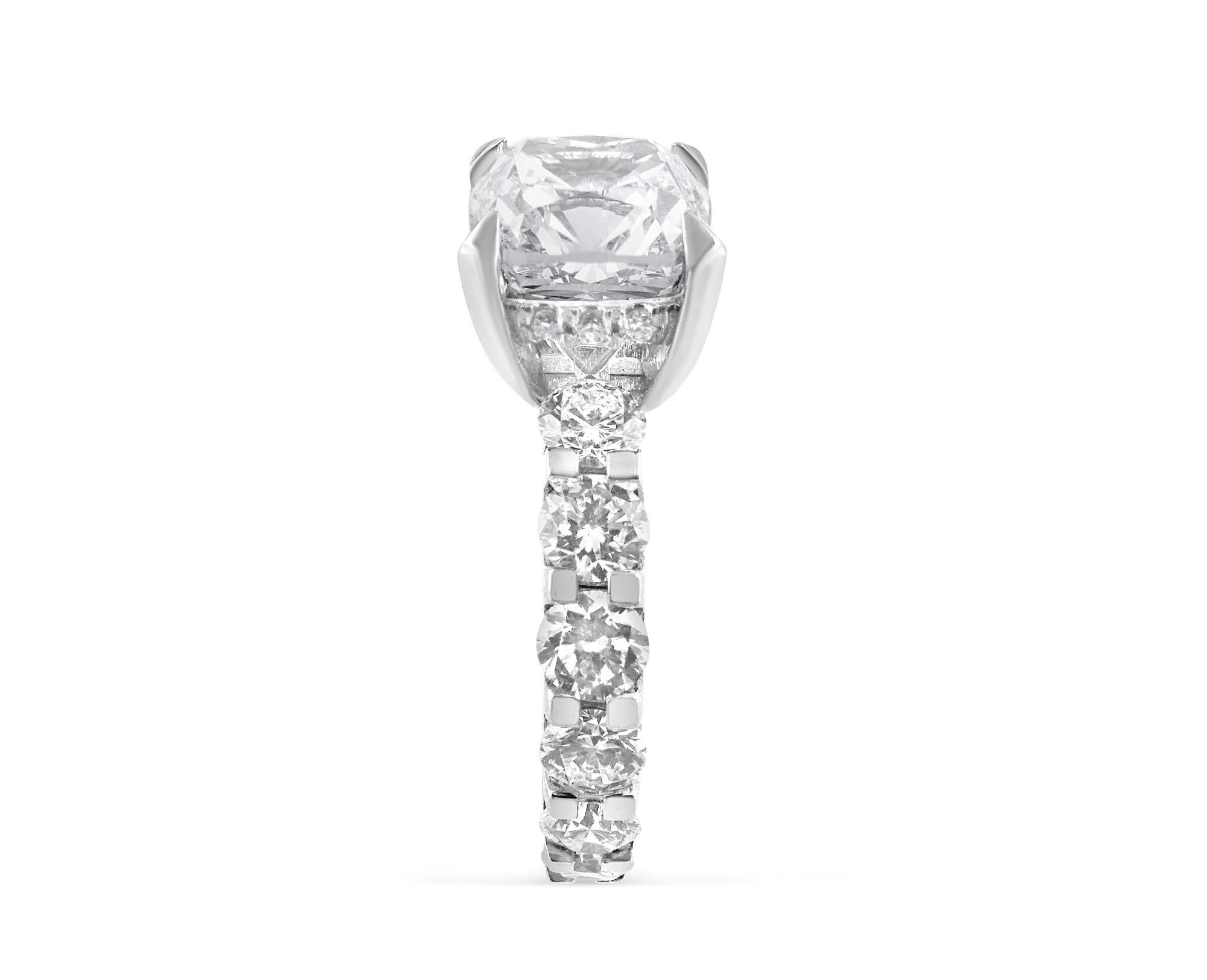 WHITE GOLD CUSHION CUT DIAMOND RING WITH SIDE STONES - 5.83 CT


Set in 18K White gold


Total cushion cut diamond weight: 3.02 ct
[ 1 diamond ]
Color: G
Clarity: VVS2

Total round white diamond weight: 2.69 ct
[ 14 diamonds ]
Color: G
Clarity: