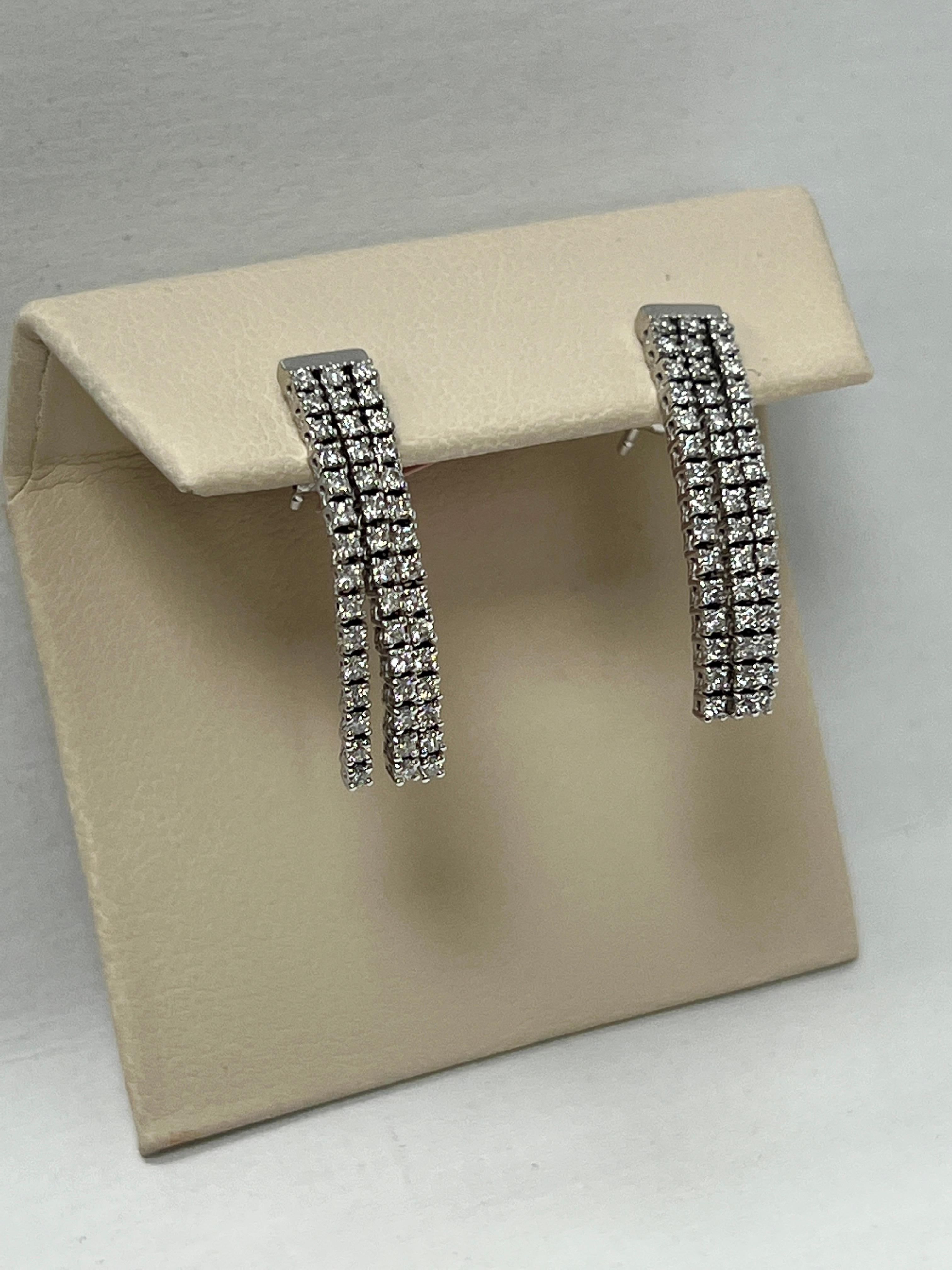Modern White Gold Dangle Diamond Earrings For Sale