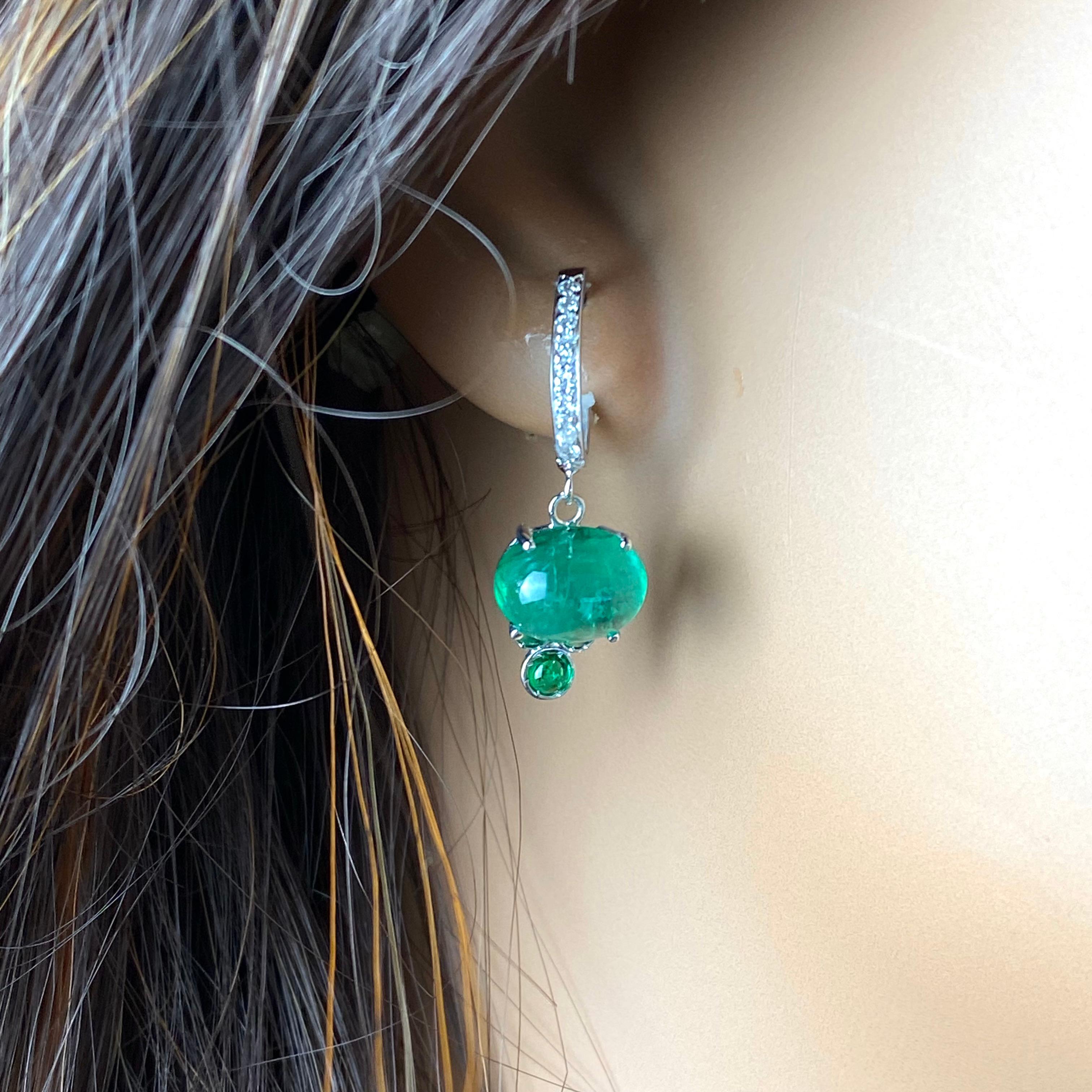 Introducing our exquisite 14 karat white gold hoop drop earrings, adorned with captivating cabochon emeralds and shimmering pave diamonds, perfect for adding a touch of elegance to any ensemble.
Primary Features:
Material: Crafted from high-quality