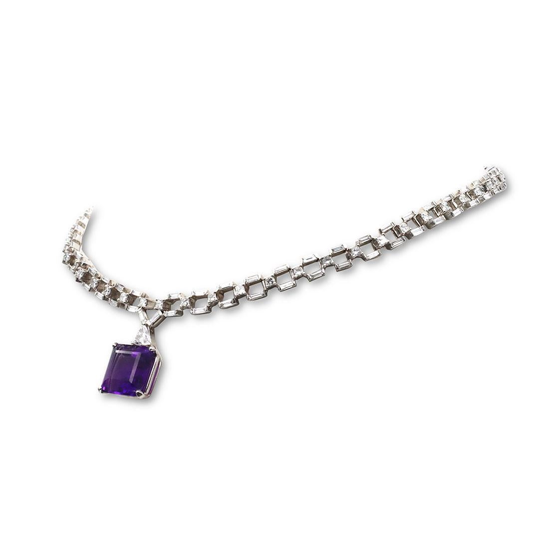 Stunning necklace crafted in 18 karat white gold is comprised of links set with square and baguette cut diamonds for an estimated 10 carat total weight. The pendant features a stunning square faceted amethyst stone with an estimated 10.08 carat