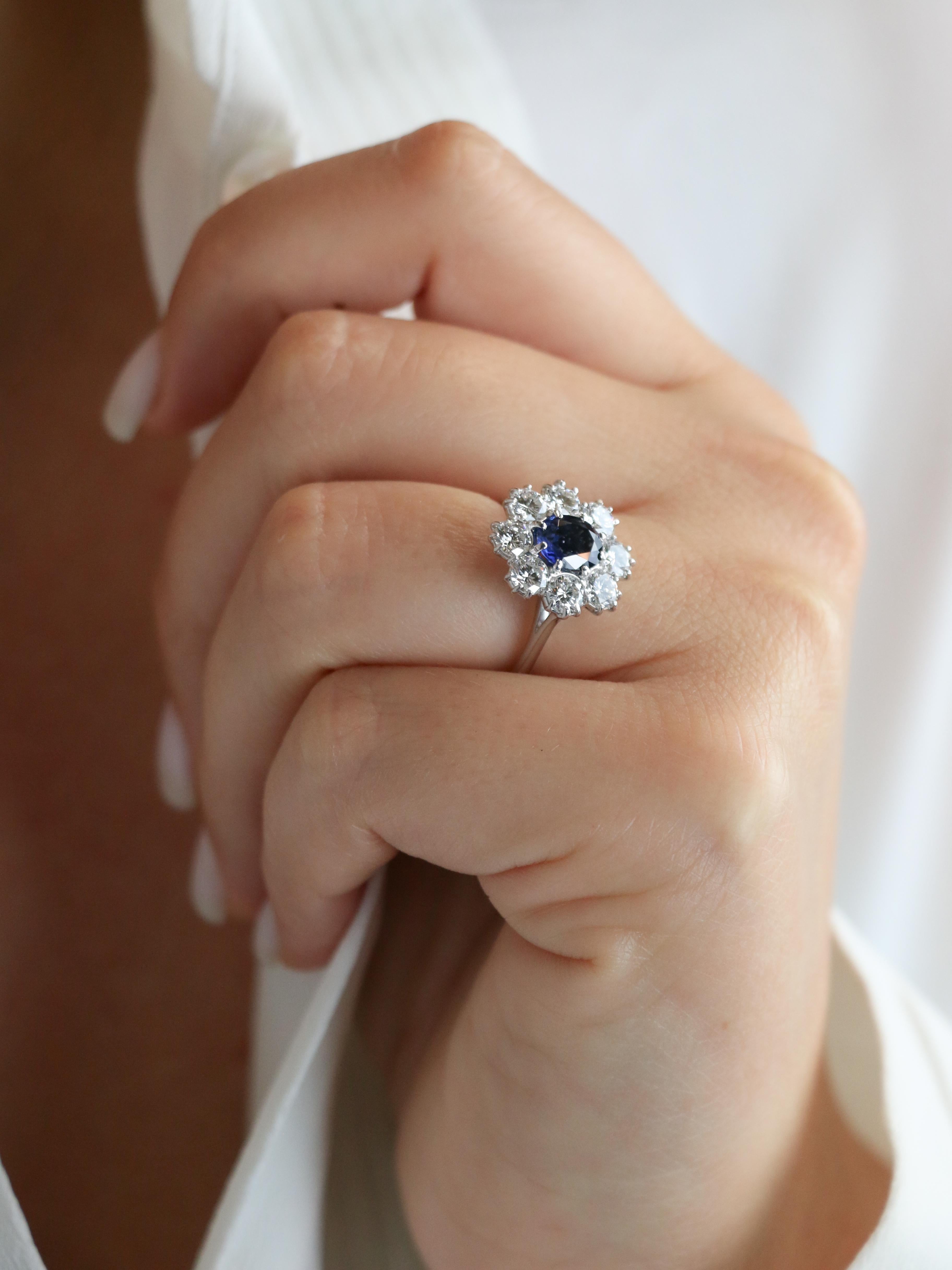 Vintage gold cluster ring with diamonds and sapphire 1.12 ct

Cluster ring in 18k gold (750°/°°) set in the center with an oval sapphire weighing 1.12 ct (Basaltic, Heated) surrounded by 8 brilliant-cut diamonds of excellent quality (DEF VS) each