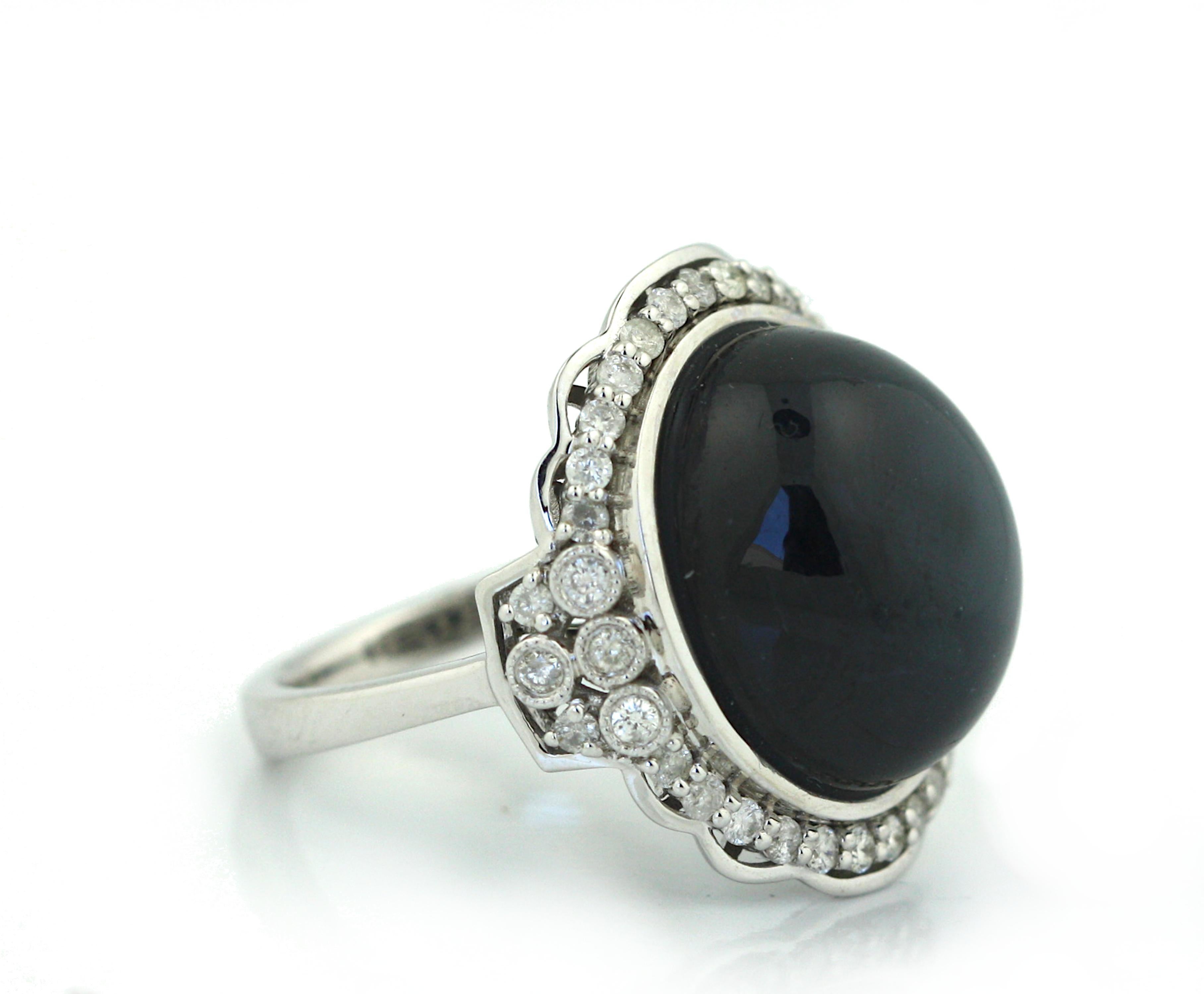 Round Cut White Gold Diamond and Blue Sapphire Ring