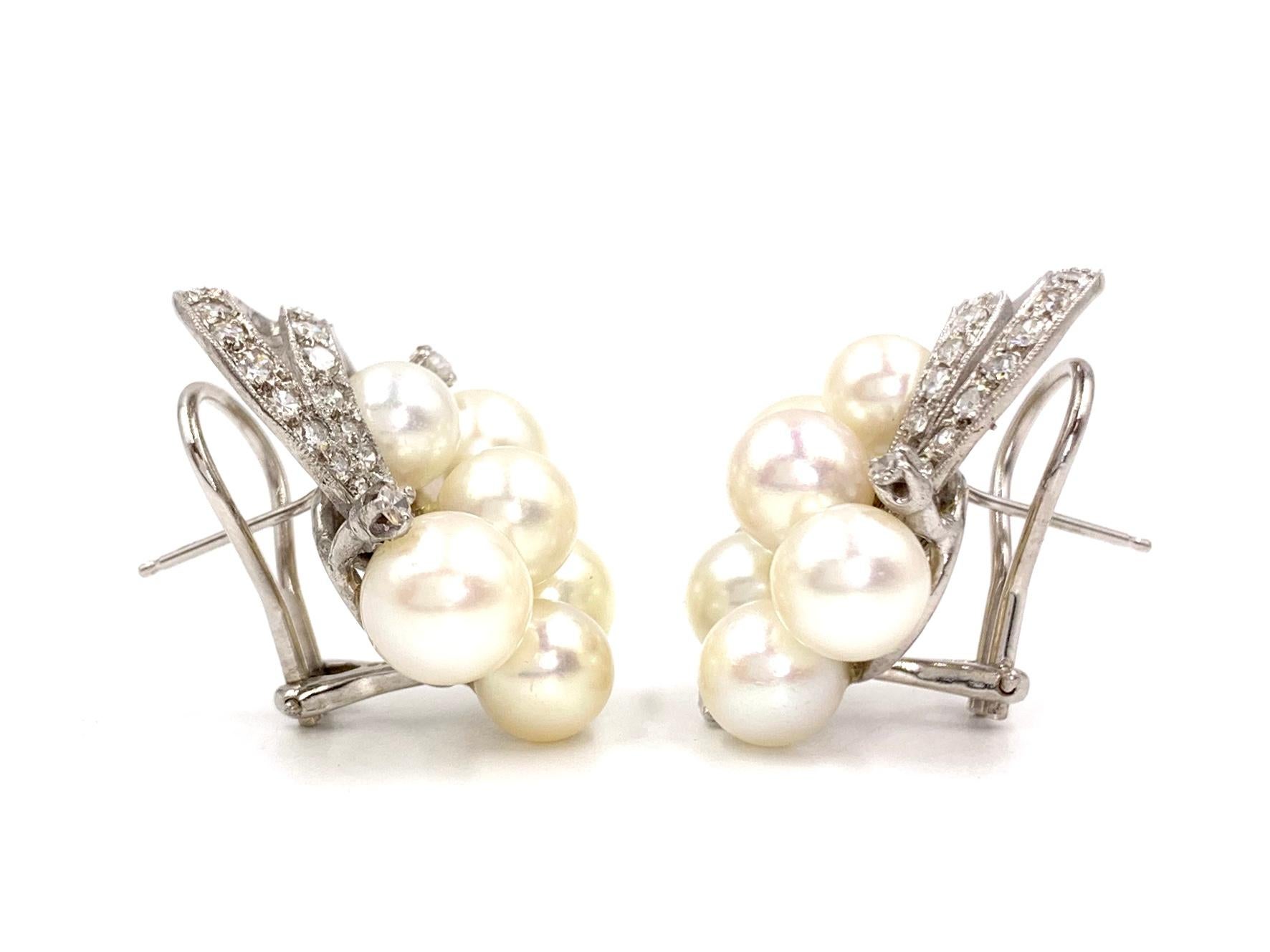 Circa 1960's, Edwardian inspired 14 karat white gold cultured pearl cluster drop earrings with single cut diamonds. Diamond total weight is approximately .40 carats total weight at approximately G color, SI1 clarity. Natural pearls have a beautiful
