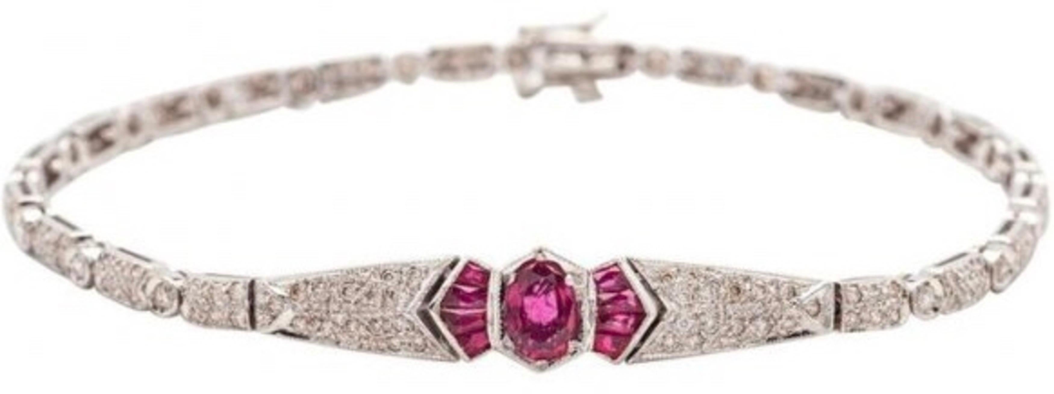 White Gold, Diamond and Ruby Bracelet, 18KT. 
Composed of rectangular and circular links, all set with circular cut diamonds, centered by an oval cut ruby weighting approximately 0.60ct., flanked by eight baguette rubies and completed by two diamond