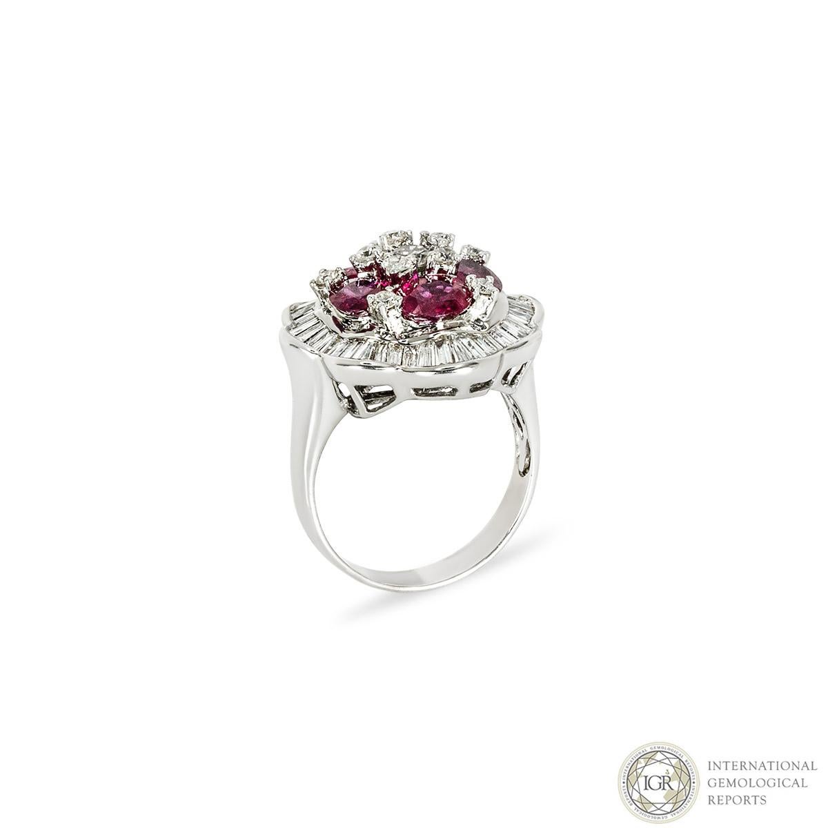 A beautiful 18k white gold ruby and diamond dress ring. The ring comprises of 6 mixed oval cut rubies complemented with baguette and round brilliant cut diamonds. The rubies have an approximate total weight of 3.50ct, with a strong pinkish-red hue