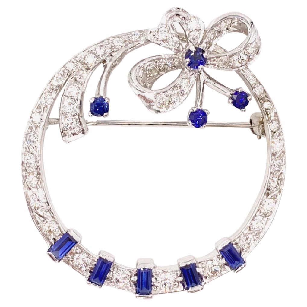White Gold Diamond and Sapphire Circle Bow Brooch For Sale