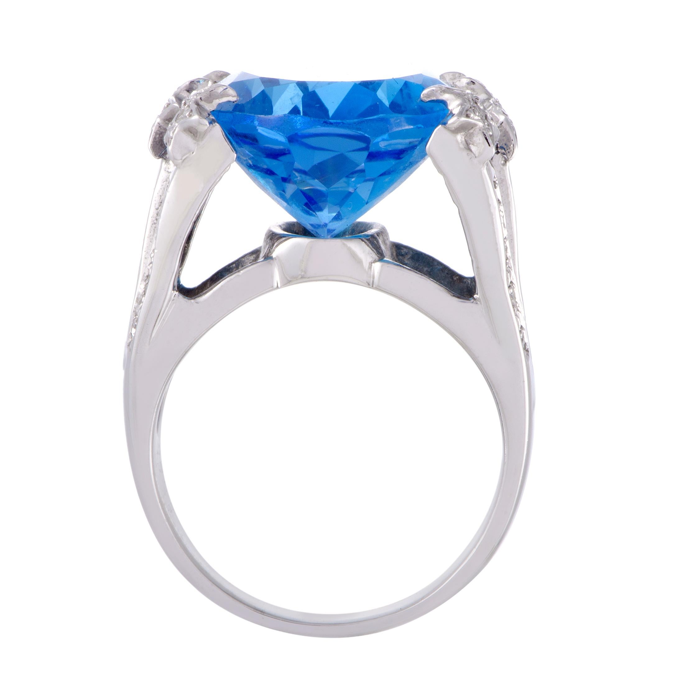 Provided a brilliant pedestal in the form of shimmering 14K white gold and resplendent diamonds weighing in total 0.26ct, the astonishing topaz weighing 25.77 carats compels with its attractive color, neat cut and sheer size.
 Ring Top Dimensions: