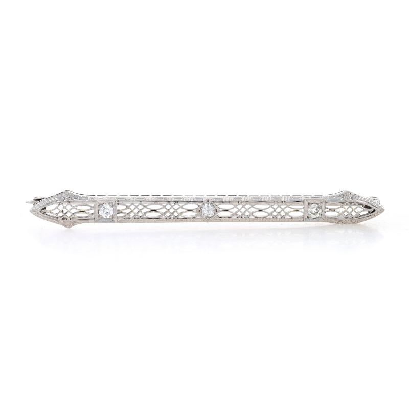 Era: Art Deco
Date: 1920s - 30s

Metal Content: 14k White Gold

Stone Information

Natural Diamonds
Carat(s): .30ctw
Cut: European
Color: H - I
Clarity: SI1 - SI2

Total Carats: .30ctw

Style: Bar Brooch
Fastening Type: Hinged Pin and Locking