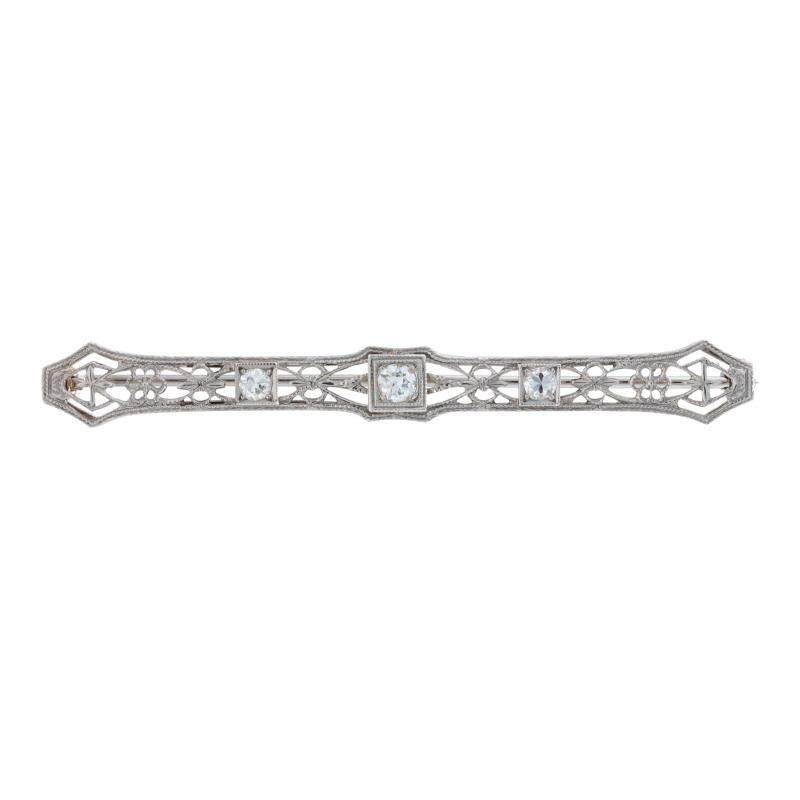 Era: Art Deco
Date: 1920s - 1930s

Metal Content: 14k White Gold

Stone Information
Natural Diamonds
Total Carats: .37ctw
Cut: European
Color: G - H
Clarity: VS1 - VS2

Style: Brooch 
Fastening Type: Hinged Pin and Locking C-Clasp
Features: Filigree