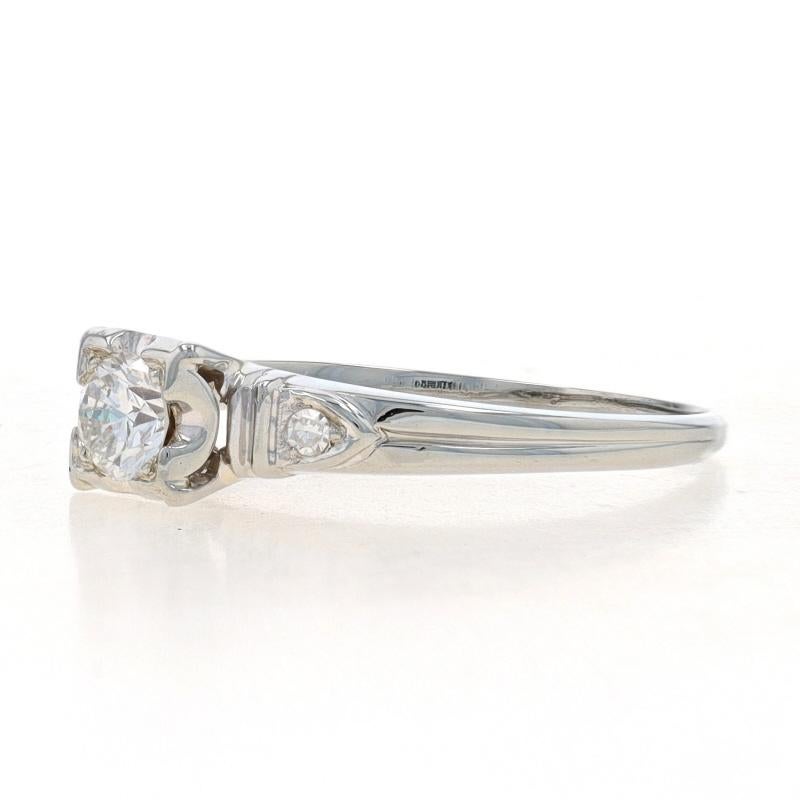 Size: 6 1/4
Sizing Fee: Up 3 sizes for $40 or Down 2 sizes for $30

Era: Art Deco
Date: 1930s - 1940s

Metal Content: 18k White Gold

Stone Information
Natural Diamond
Carat(s): .22ct
Cut: Round Brilliant
Color: H
Clarity: VS1

Natural