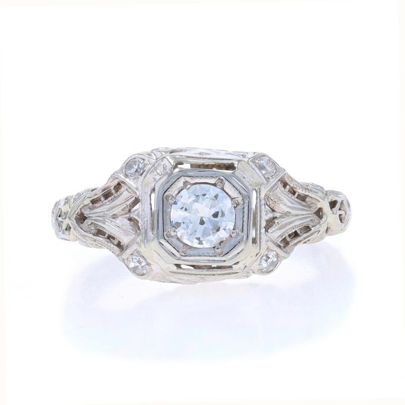 Size: 5 1/2
Sizing Fee: Up 2 1/2 sizes for $60 or Down 1 size for $40

Era: Art Deco
Date: 1940

Metal Content: 18k White Gold

Stone Information

Natural Diamond
Carat(s): .26ct
Cut: Transitional
Color: H
Clarity: VS2

Natural Diamonds
Carat(s):