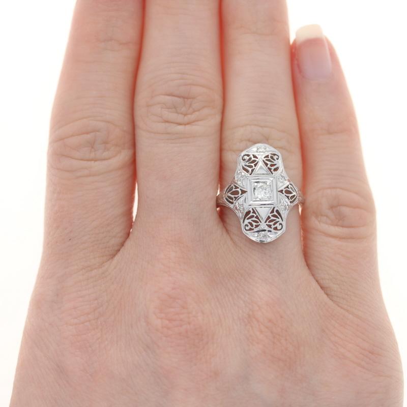 Size: 6 1/2
Sizing Fee: Down 1 for $35 or up 2 for $40

Era: Art Deco
Date: 1920s-1930s

Metal Content: 18k White Gold

Stone Information

Natural Diamond
Carat(s): .18ct
Cut: European
Color: H
Clarity: VS2
Stone Note: (solitaire)

Natural