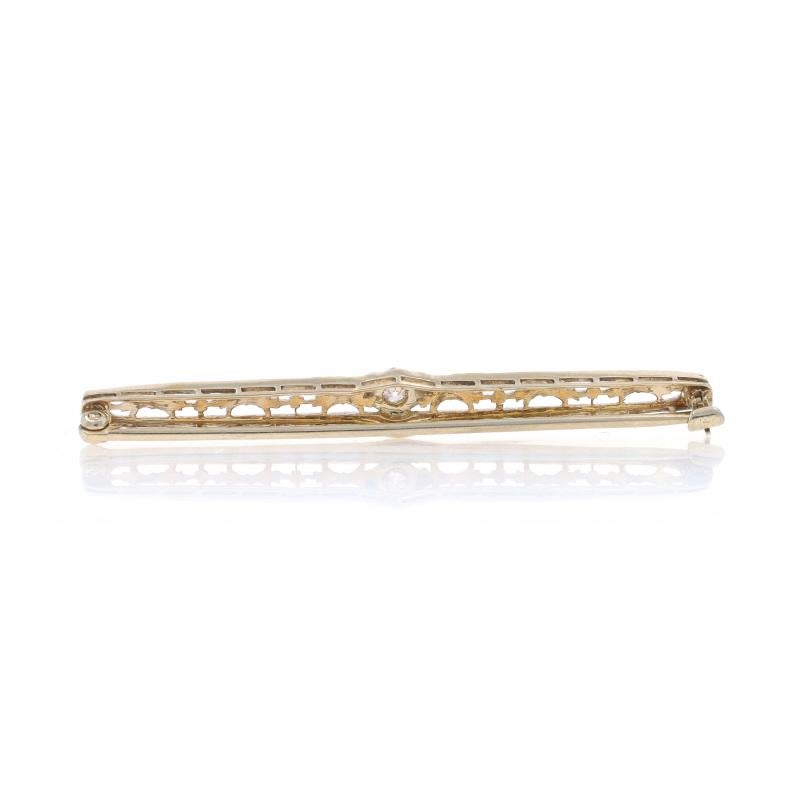 Era: Art Deco
Date: 1920s - 1930s

Metal Content: 14k White Gold & 14k Yellow Gold

Stone Information

Natural Diamond
Carat(s): .06ct
Cut: European
Color: K
Clarity: SI2

Style: Solitaire Bar Brooch
Fastening Type: Hinged Pin and Locking