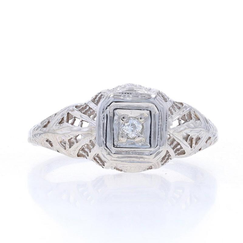 Size: 5
Sizing Fee: Up 2 sizes for $50 or Down 1 size for $35

Era: Art Deco
Date: 1920s - 1930s

Metal Content: 18k White Gold

Stone Information

Natural Diamond
Carat(s): .05ct
Cut: European
Color: F
Clarity: SI2

Style: Solitaire
Features: