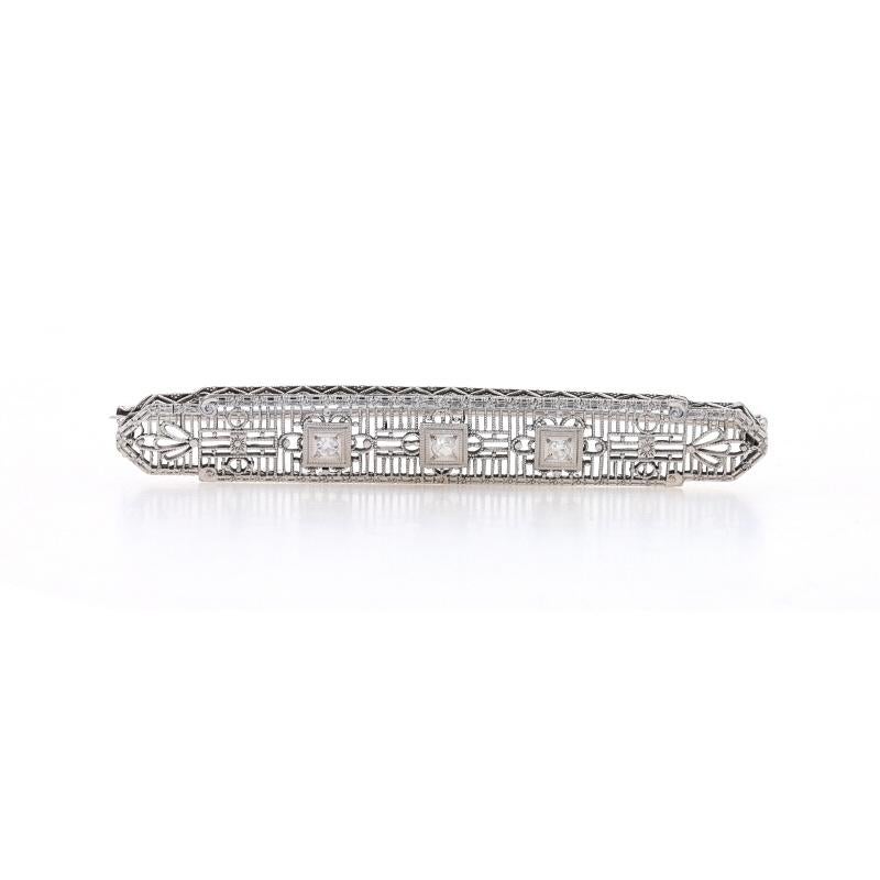 Era: Art Deco
Date: 1920s - 1930s

Metal Content: 14k White Gold

Stone Information

Natural Diamonds
Carat(s): .09ctw
Cut: Single
Color: G - H
Clarity: SI1 - SI2

Style: Three-Stone Bar Brooch
Fastening Type: Hinged Pin and Locking