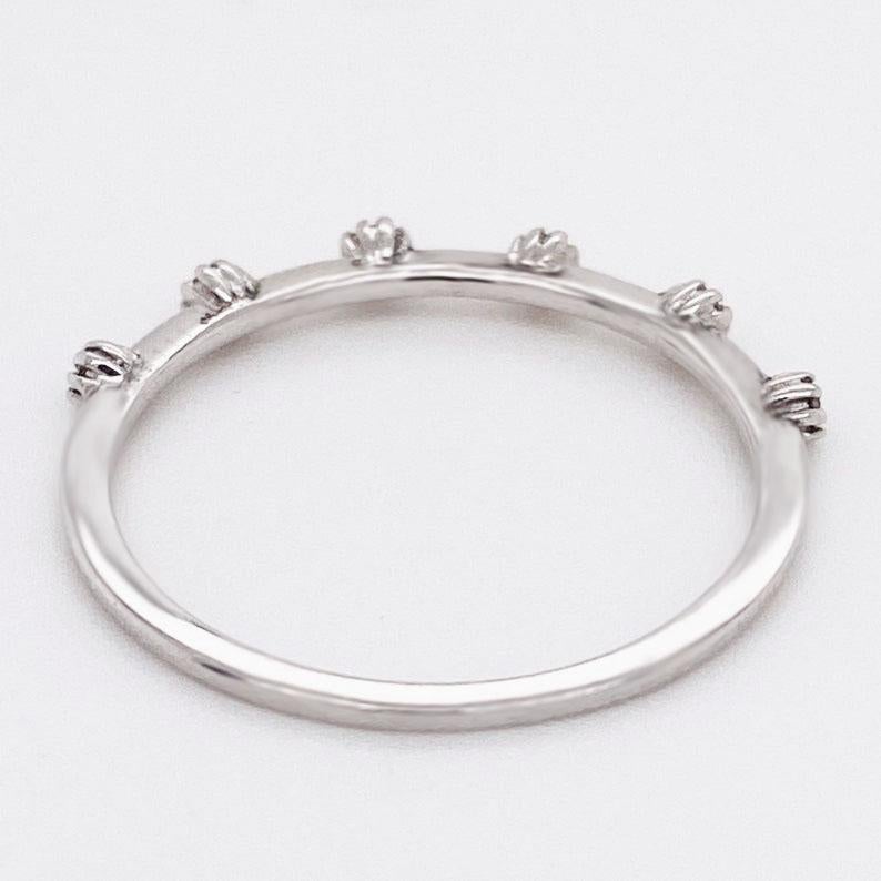 Adorable Diamond Band, perfect for adding character to your ring stack! This diamond band is a constellation design of round brilliant diamonds lined up perfectly like stars! The round brilliant diamonds are bright white and sparkle brilliantly from