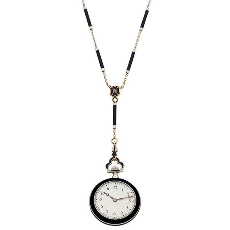 This unique and wonderful pendant-watch necklace is an original Art Deco circa 1920s. It comes with a dial that has enamel numerals and fine enamel minute bars on the perimeter. The watch crystal is held within a fine gold ring and surrounded by a