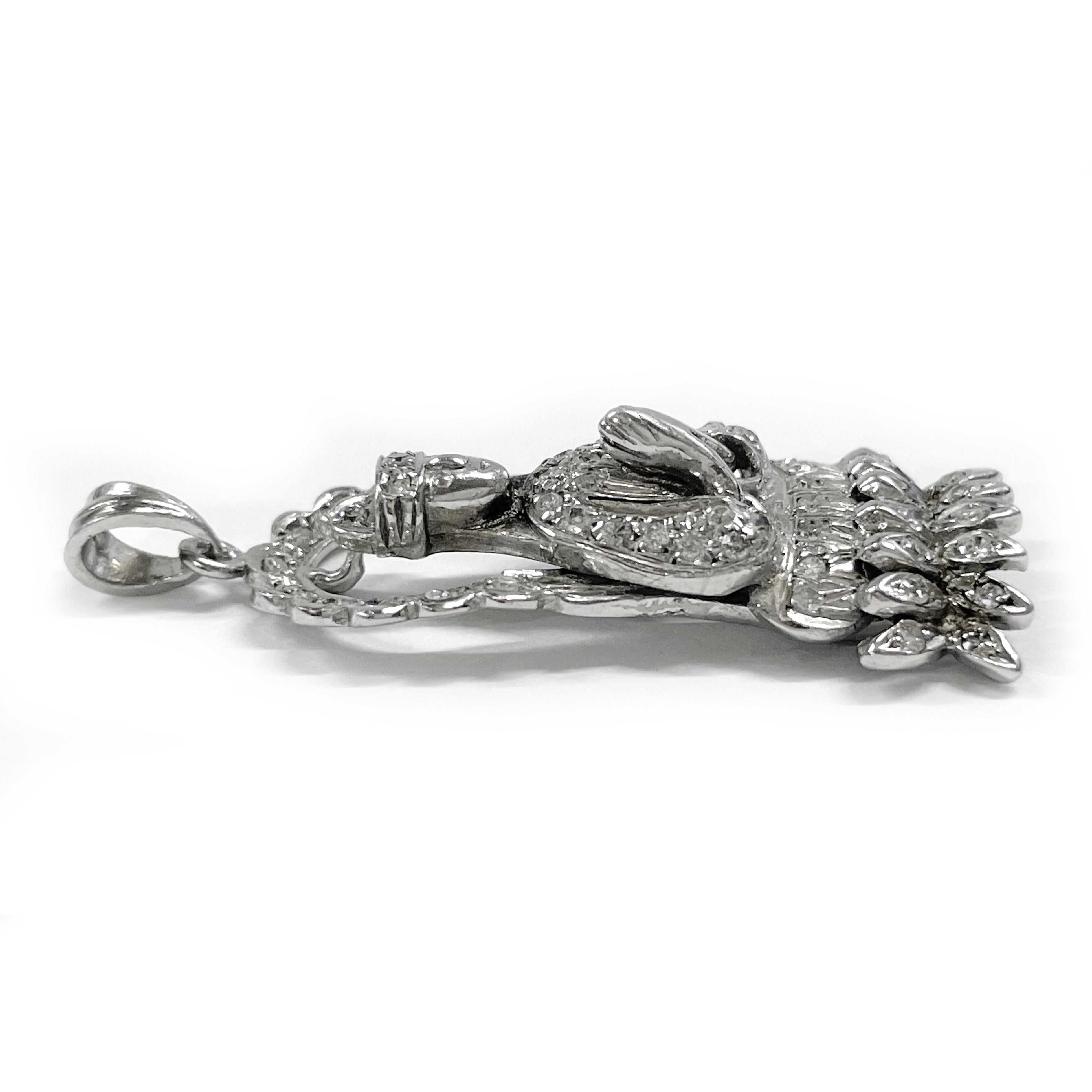 18 Karat White Gold Diamond Buddha Pendant. The pendant features a praying Buddha with round 1.5mm diamonds adorning the majority of the pendant. There is a total of fifty-one single cut diamonds bead-set on white gold. The diamonds have a total