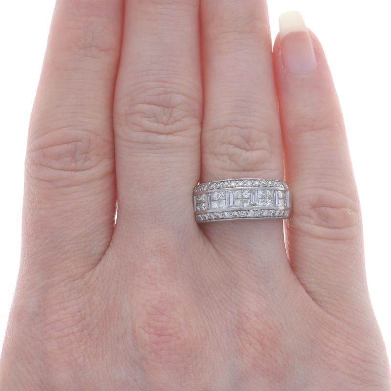 Size: 6

Metal Content: 14k White Gold

Stone Information

Natural Diamonds
Carat(s): 1.20ctw
Cut: Round Brilliant, Baguette, & Princess
Color: G - H
Clarity: VS1 - SI1

Total Carats: 1.20ctw

Style: Cluster Cocktail Band

Measurements

Face Height