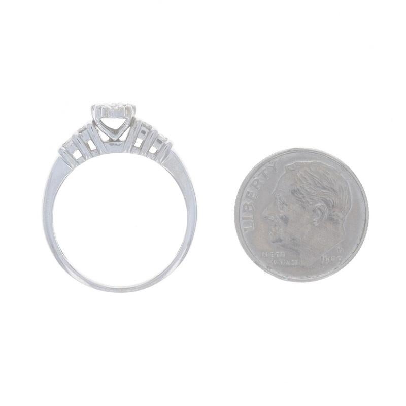 Women's White Gold Diamond Cluster Engagement Ring - 10k Round & Baguette .50ctw For Sale