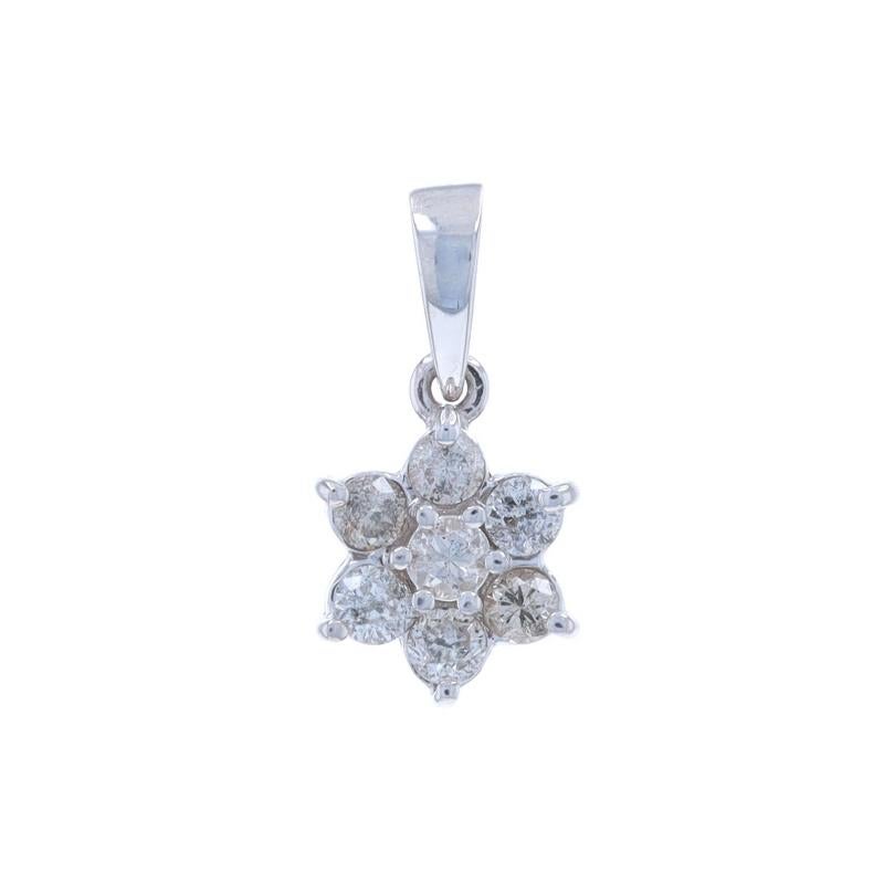 Metal Content: 10k White Gold

Stone Information

Natural Diamonds
Carat(s): .50ctw
Cut: Round Brilliant
Color: H - I
Clarity: SI2 - I1

Total Carats: .50ctw

Style: Cluster Halo
Theme: Flower Blossom

Measurements

Tall (from stationary bail):