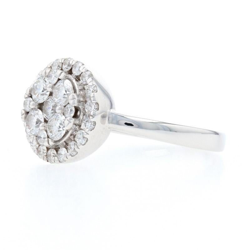 Your quest for the perfect birthday or anniversary gift ends here with this gorgeous ring! Fashioned in popular 14k white gold, the ring features a diamond rosette bordered in a halo of diamond accents. Open ports under the face of the ring allow