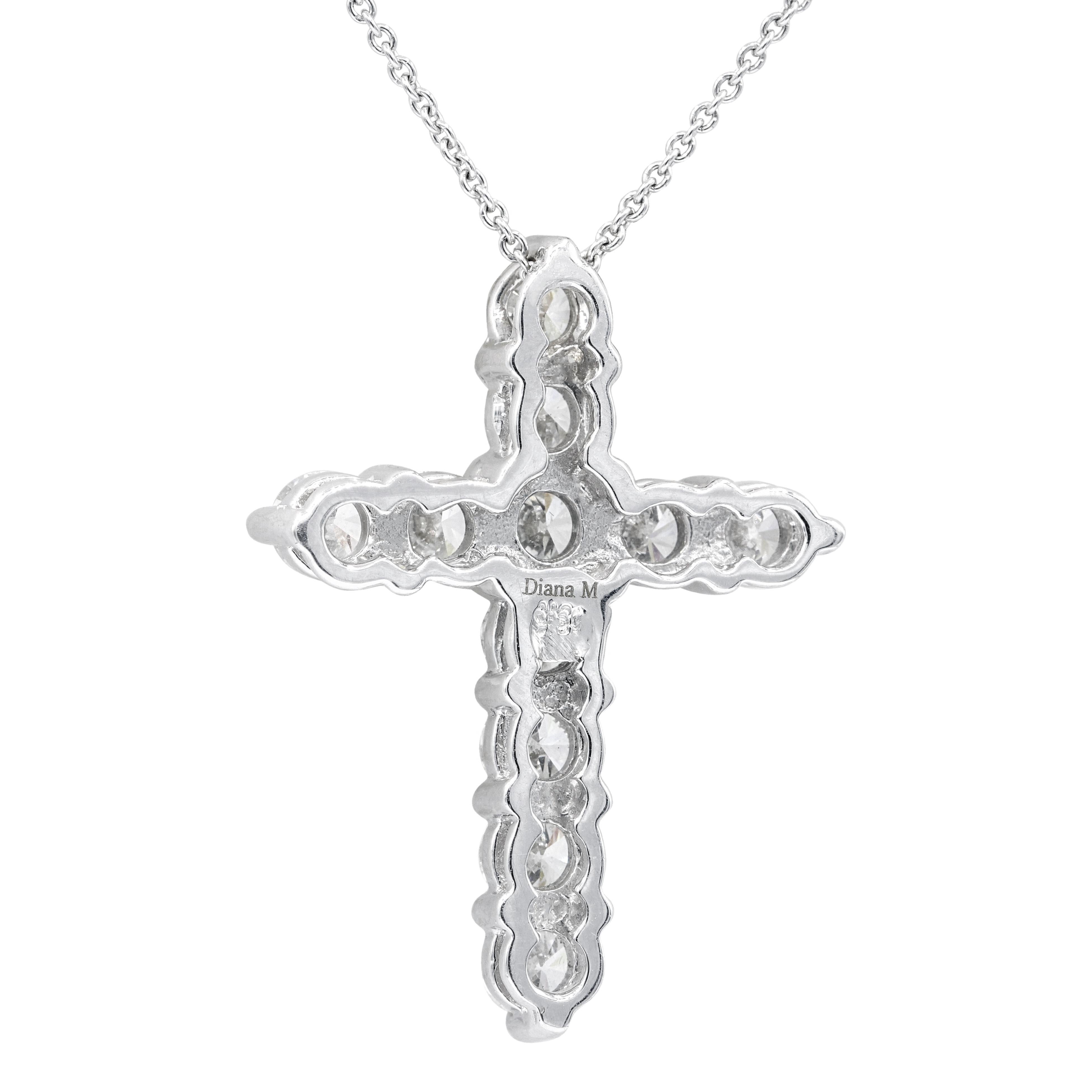 18KT white gold diamond cross pendant with the chain, features 3.10 ct of 11 round diamonds
Size: 1