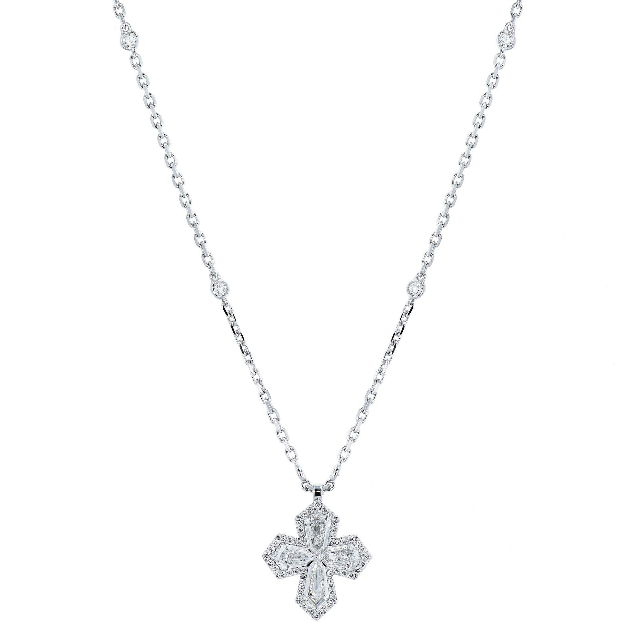 Elevate yourself with this awe-inspiring Diamond Cross White Gold Pendant Necklace.
This beautiful cross and necklace are crafted with 18 Karat white gold. It boasts 1.57 carats of F-VS1, 0.25ct F-SI diamonds, 0.25ct F-VS diamonds, and 1.12ct F-VS