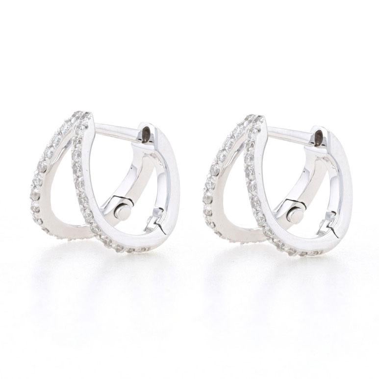 Metal Content: 14k White Gold 

Stone Information: 
Natural Diamonds
Total Carats: .26ctw 
Cut: Round Brilliant 
Color: F - G 
Clarity: VS1 - VS2

Style: Double Huggie Hoop
Fastening Type: Snap Closures 

Measurements: 
Tall: 13/32