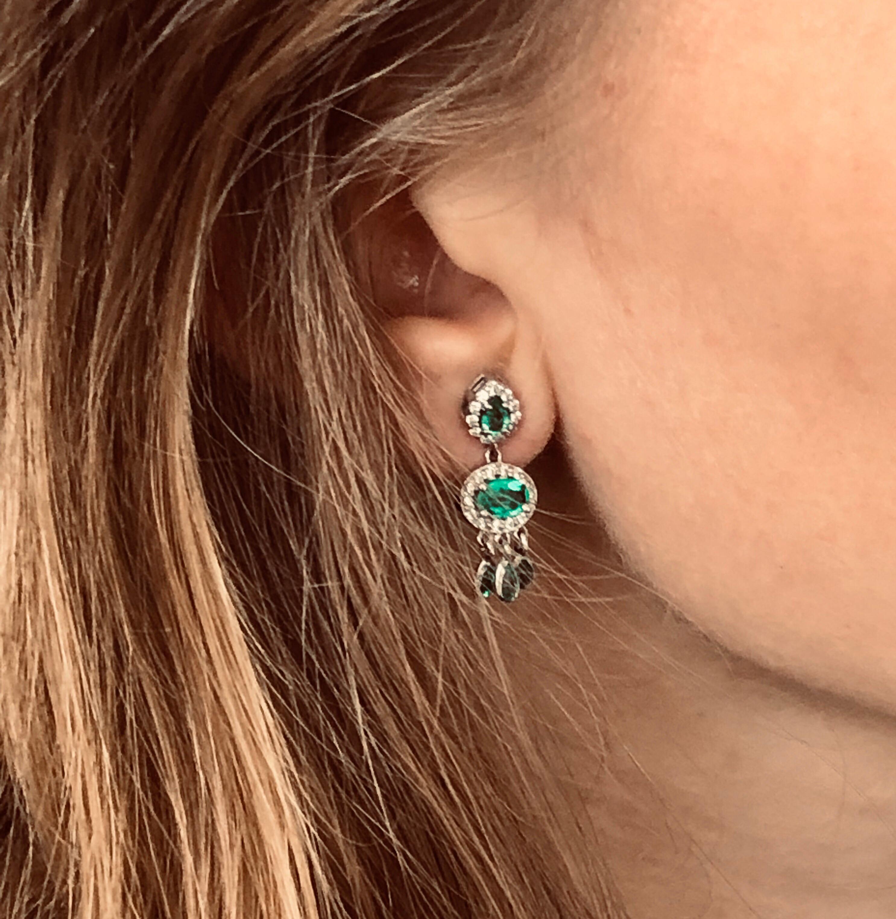Oval Cut Diamond and Emerald Drop Dangle Eighteen Karat White Gold Earrings 