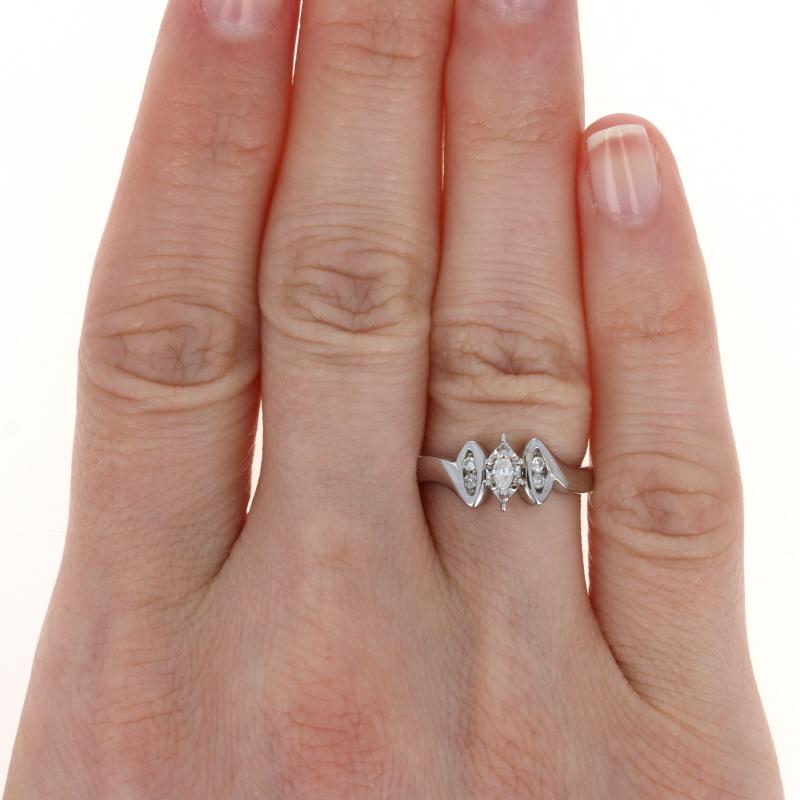 Size: 5 1/4
Sizing Fee: Up 2 sizes for $25 or down 2 sizes for $20

Metal Content: 10k White Gold 

Stone Information: 
Natural Diamonds
Total Carats: .16ctw
Cuts: Marquise & Round Brilliant 
Color: G - H
Clarity: SI2 - I1

Style: Solitaire with