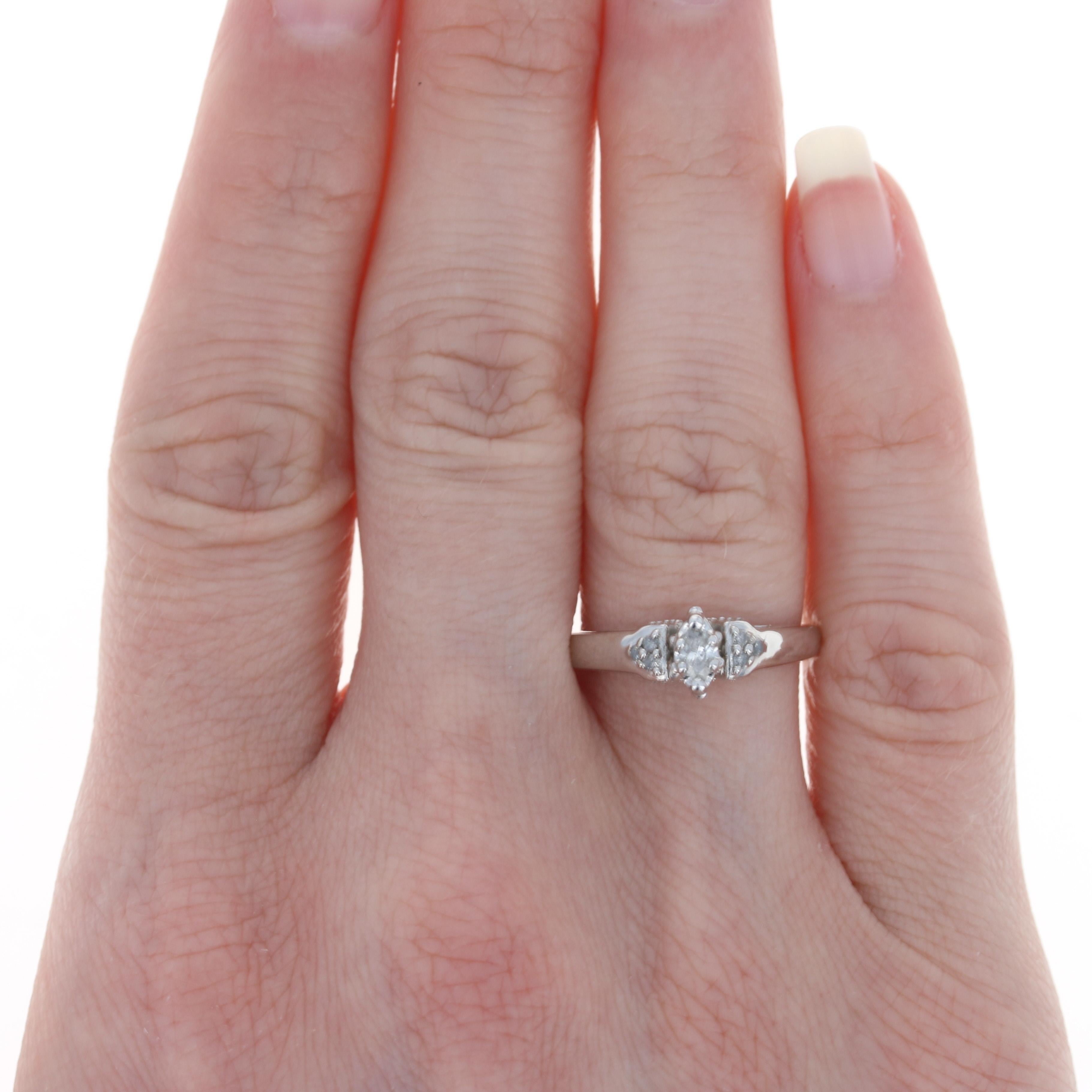 Size: 6
Sizing Fee: Down 2 sizes for $20 or Up 2 sizes for $25

Metal Content: 10k White Gold 

Stone Information: 
Natural Diamonds
Total Carats: .25ctw
Cuts: Marquise & Round Brilliant
Color: G - H
Clarity: I1 - I2

Style: Solitaire with