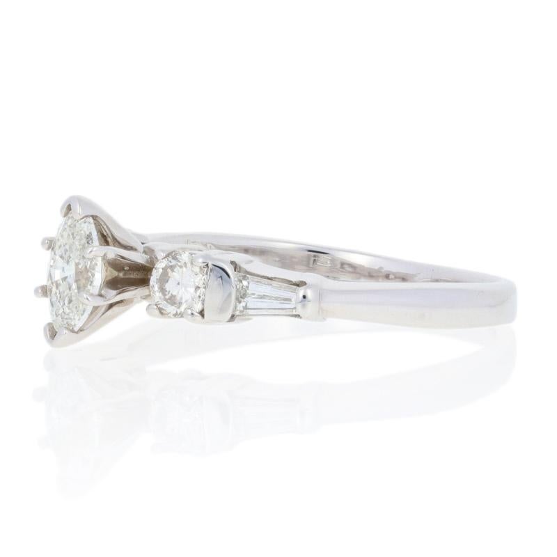 This ring is a size 7 1/4.

Metal Content: Guaranteed 14k Gold as stamped

Stone Information: 
Natural Diamonds  
Clarity: SI1 - SI2
Color: I - J
Cuts: Marquise, Round Brilliant, & Baguette 
Total Carats: 0.60ctw

Style: Solitaire with Accents 
Face