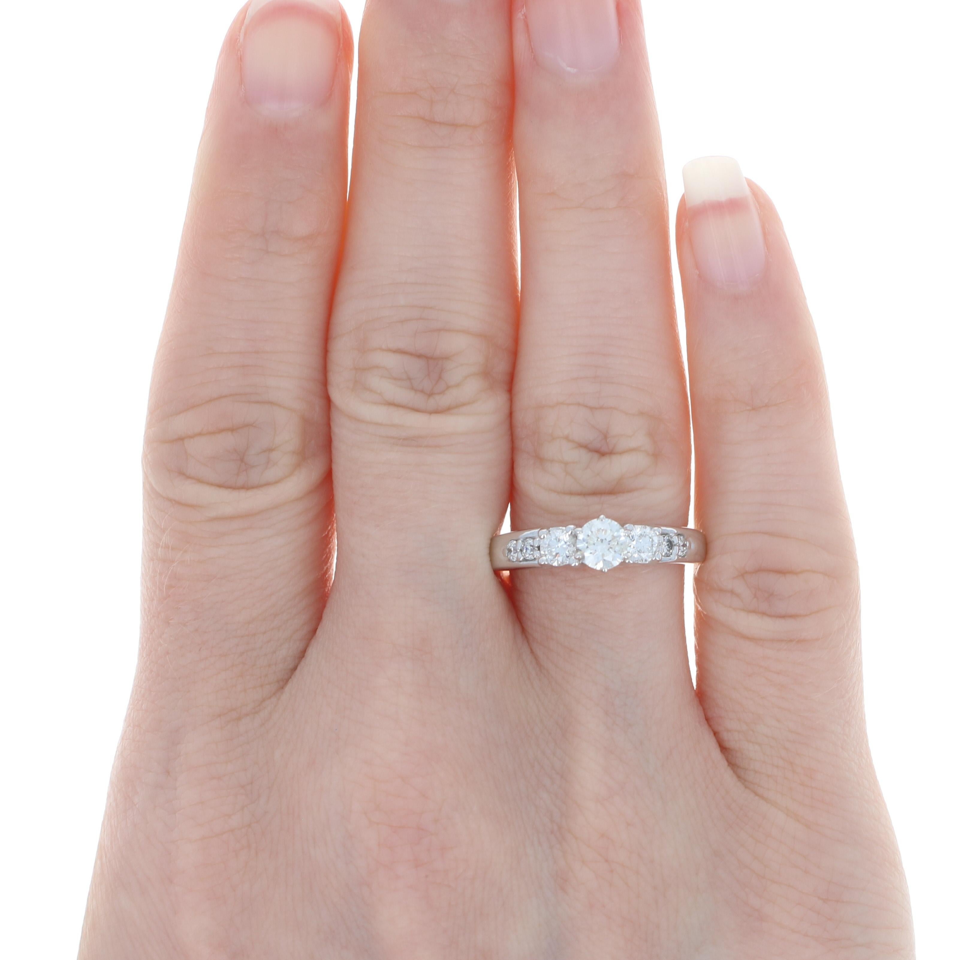Like effervescent champagne sparkling in candlelight, this radiant engagement ring will absolutely delight your sweetheart! This 14k white gold piece showcases a resplendent diamond solitaire that is held in a raised four-prong mount above a