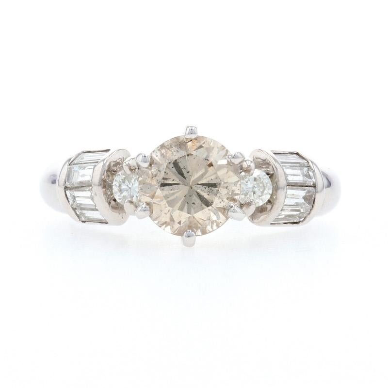 Begin the next chapter of your love story with this exquisite engagement ring! Fashioned in 14k white gold, this piece showcases a luminous light brown diamond solitaire that is beautifully cradled in a six-prong mount above the glittering diamond