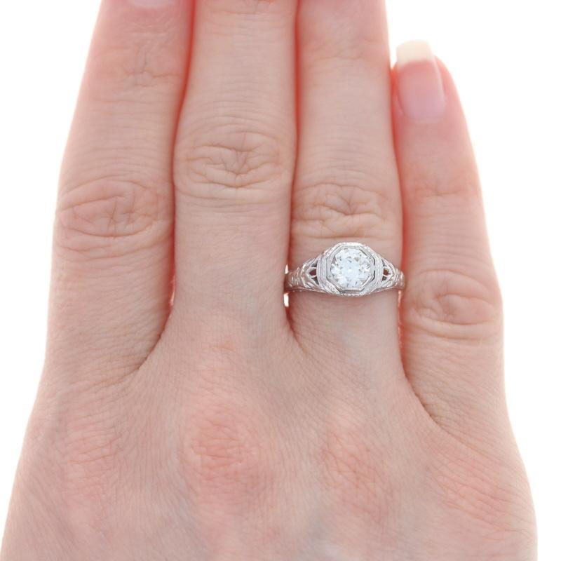 Size: 5 3/4
Sizing Fee: Down 1 for $80 or up 2 for $100

Design: Art Deco-Inspired Style

Metal Content: 18k White Gold

Stone Information
Natural Diamond Solitaire
Carat(s): .71ct
Cut: European
Color: K
Clarity: VS1
Certified by: EGL USA
Report