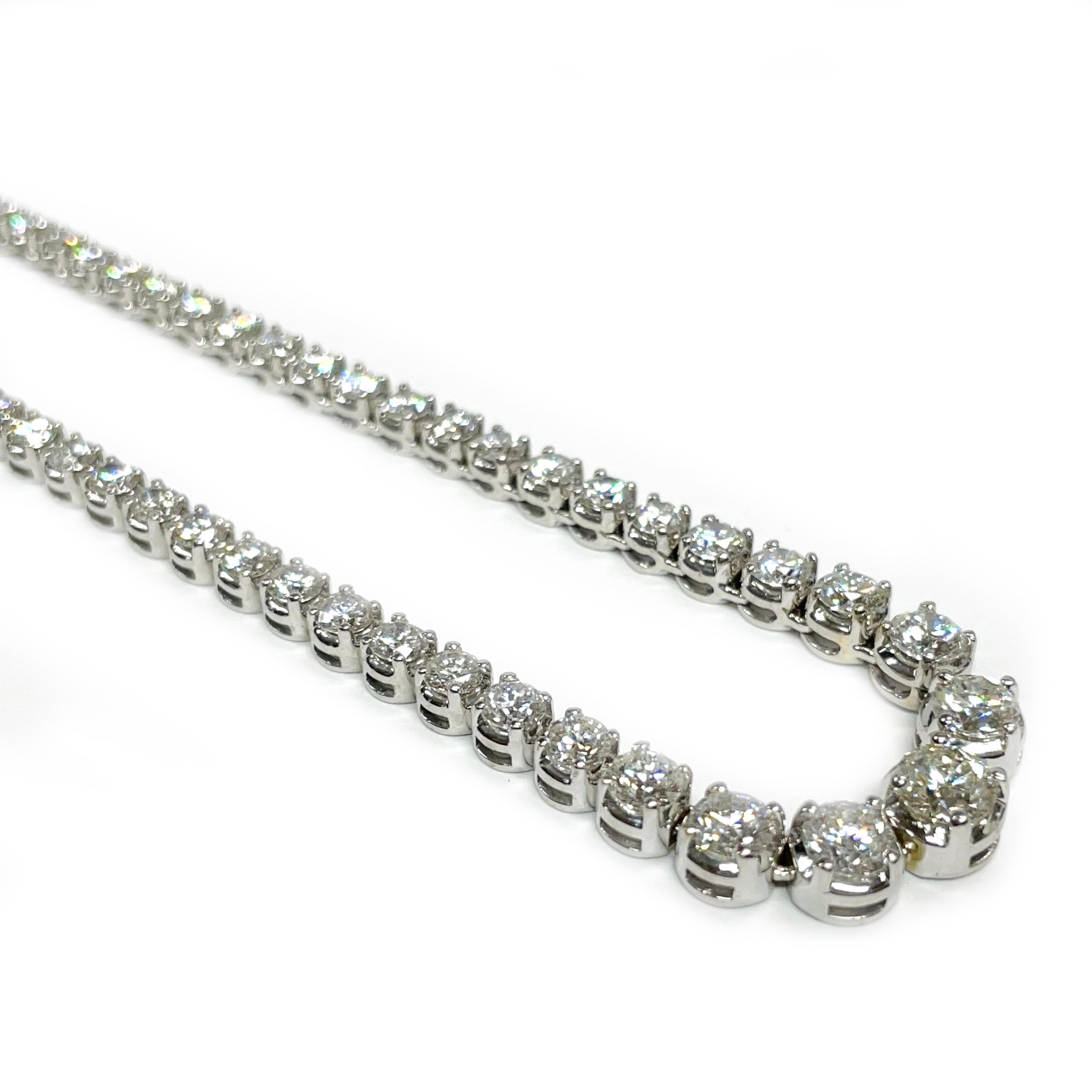 18 Karat White Gold Diamond Eternity Necklace. An absolutely gorgeous necklace featuring one hundred forty-five round prong-set diamonds with a carat total weight of 11.75ctw. The graduate diamonds range in size from 2.22 - 5.3mm. The diamonds are