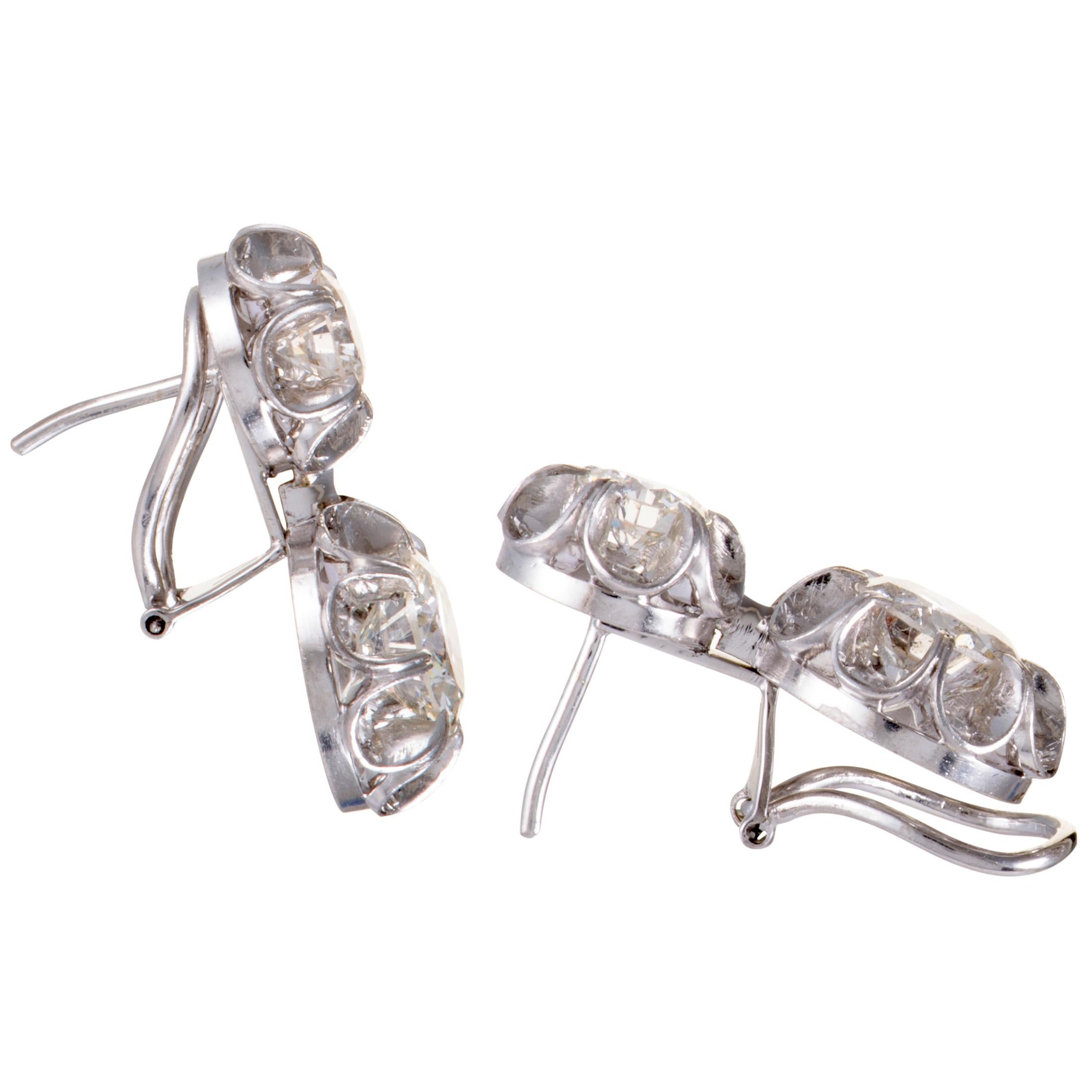 Designed in a wonderfully classic manner and lavishly decorated with luxuriously resplendent diamonds, these stunning 18K white gold earrings offer an exceptionally splendid look of refined sophistication. The pair boasts a total of 0.90 carats of