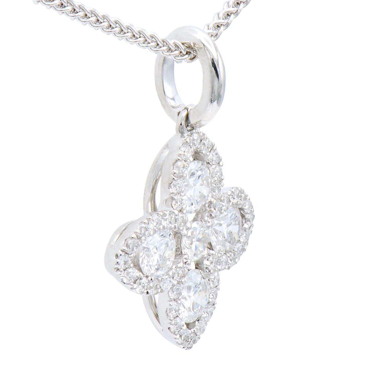 This beautiful pendant is made from 5 white gold diamonds totaling 0.35 carats which are surrounded by 40 round VS2, G color diamonds totaling 0.11 carats. Together they form a lovely flower or four-leaf shape that is very classic and timeless. The