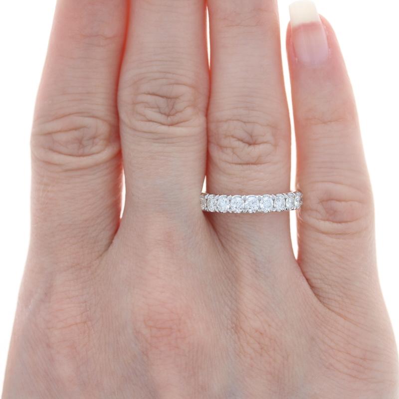 Size: 7 
Sizing Fee: Up 2 sizes or Down 1 size for $50 

Metal Content: 18k White Gold 

Stone Information: 
Natural Diamonds
Total Carats: .98ctw 
Cut: Round Brilliant 
Color: G 
Clarity: VS2 - SI1 

Style: Wedding Band with French Set Diamonds
