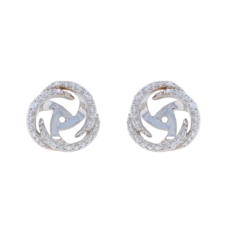 Metal Content: 18k White Gold

Stone Information
Natural Diamonds
Carat(s): .25ctw
Cut: Round Brilliant
Color: F - G
Clarity: VS1 - VS2

Total Carats: .25ctw

Style: Halo Earring Enhancer Stud Jackets
Theme: Circle

Measurements
Tall: 13/32