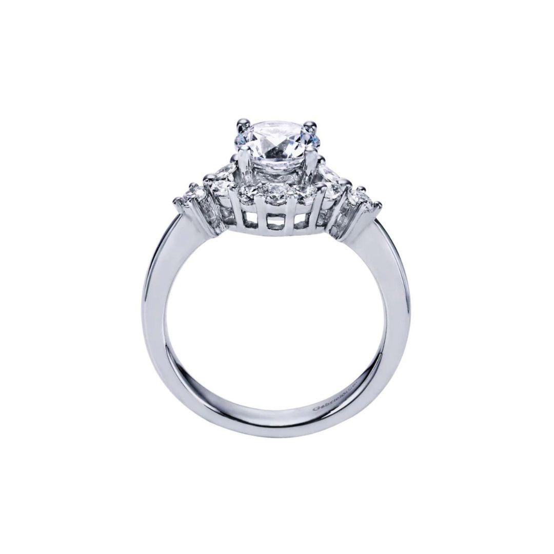 ﻿Ladies' 14k Diamond Engagement Ring﻿. Elegant halo wraps around the center diamond and two side diamonds adorn the edges of a clean high polish shank. Classic halo look. Center diamond included, 0.50 ct, H-I color, SI2 clarity. Side diamonds 0.41