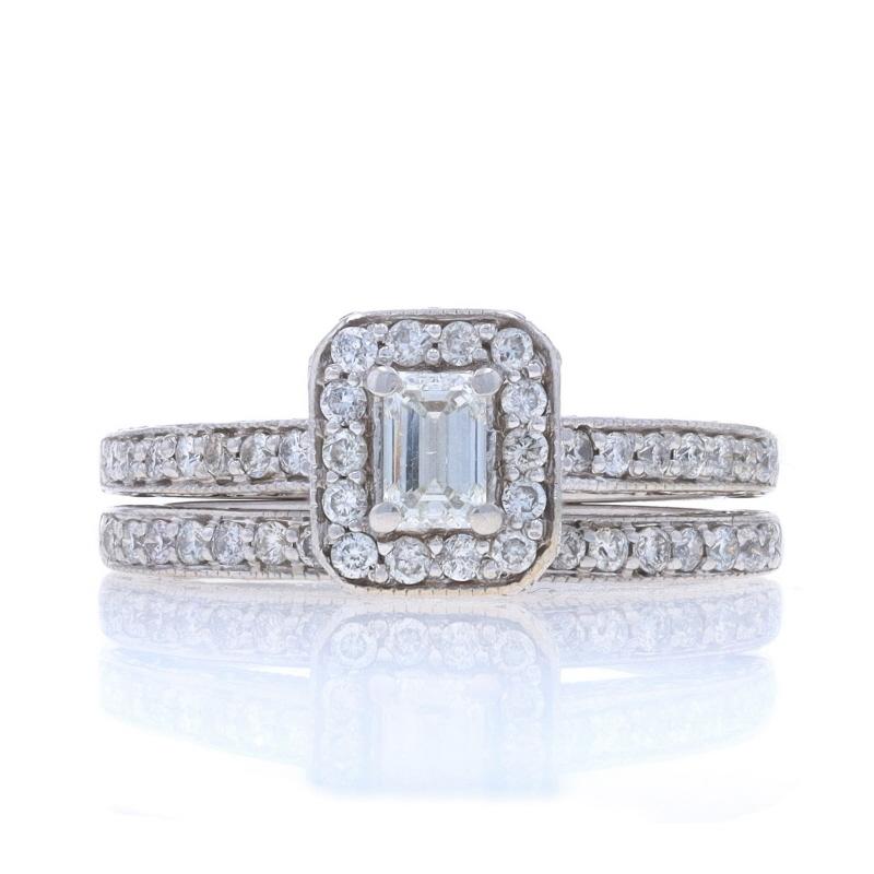 Size: 4 3/4
Sizing Fee: Up 2 sizes for $80 or Down 1/2 a size for $60

Metal Content: 14k White Gold

Stone Information

Natural Diamond
Carat(s): .24ct (carat stamp)
Cut: Emerald
Color: H
Clarity: VS2

Natural Diamonds
Carat(s): .50ctw
Cut: Round