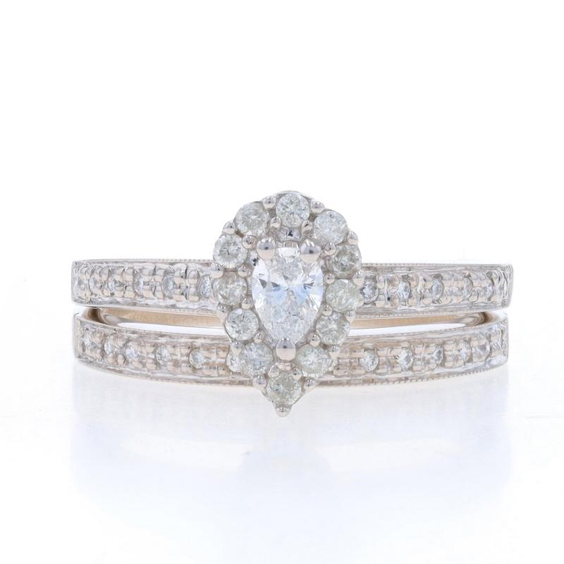 Size: 7
Sizing Fee: Up 2 sizes for $60 or Down 1 size for $40

Metal Content: 14k White Gold

Stone Information
Natural Diamond
Carat(s): .17ct
Cut: Pear
Color: F
Clarity: I1
Stone Note: (solitaire)

Natural Diamonds
Carat(s): .37ctw
Cut: Round