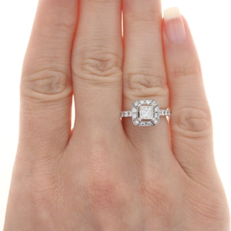 Size: 5 1/4
Sizing Fee: Up 2 sizes for $120

Metal Content: 14k White Gold

Stone Information

Natural  Diamond
Carat(s): .74ct (weighed)
Cut: Princess
Color: I
Clarity: I1
Stone Note: (solitaire)

Natural  Diamonds
Carat(s): 1.02ctw
Cut: Round