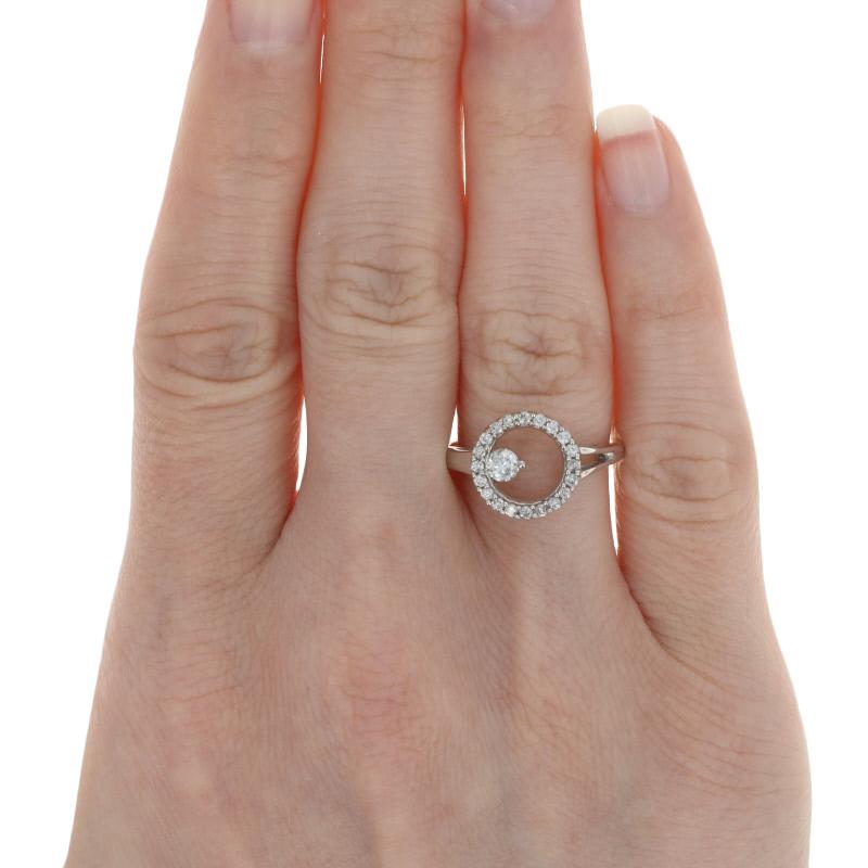 Size: 6 3/4
Sizing Fee: Up or Down 2 sizes for $25

Metal Content: 14k White Gold

Stone Information: 
Natural Diamonds  
Clarity: I1
Color: G - H
Cut: Round Brilliant 
Total Carats: 0.50ctw

Style: Solitaire with Accents / Halo
Face Height (north
