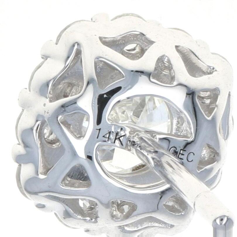 White Gold Diamond Halo Stud Earrings, 14k Round Brilliant Cut .95 Carat Pierced In New Condition In Greensboro, NC