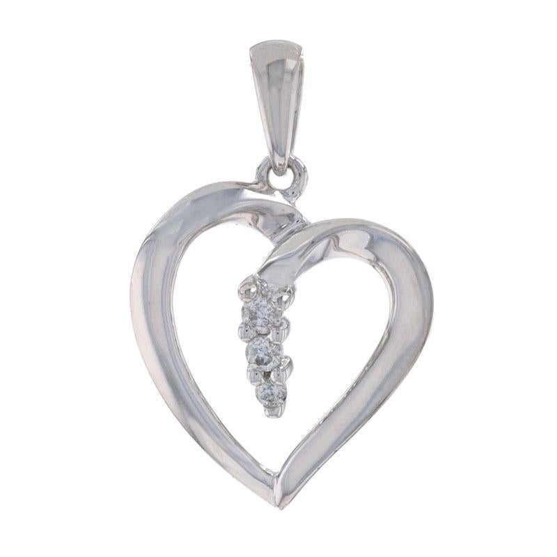 Metal Content: 14k White Gold

Stone Information
Natural Diamonds
Total Carat(s): .07ctw
Cut: Round Brilliant
Color: G
Clarity: SI2 - I1

Theme: Heart, Love

Measurements
Tall (from stationary bail): 5/8